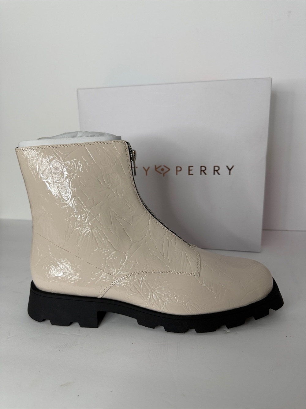Katy Perry Collections Cream Patent Zip Ankle Boot with Lug Sole